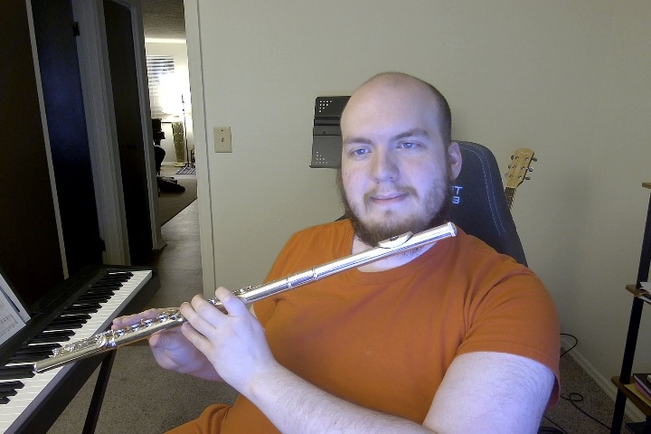 Caleb Brookmyer holding his flute